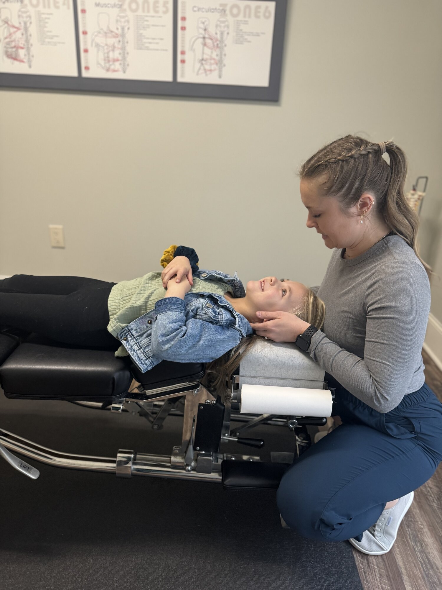 Dr. Corie Terwilliger, D.C., Webster-certified chiropractor, providing pediatric care at Georgia Spine and Sports Rehab